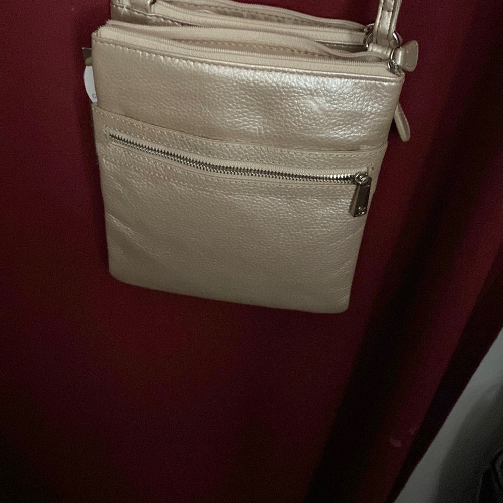 Gold leather multi-zip bag.
